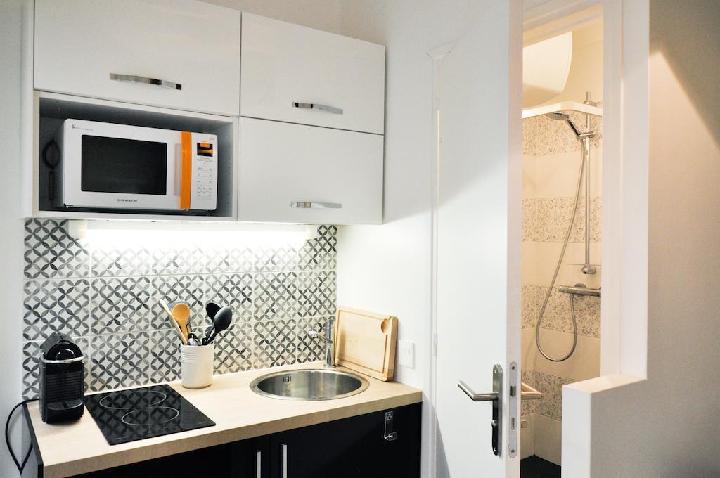 Duplex De Charme Au Coeur De Montmartre Apartamento Paris Quarto foto