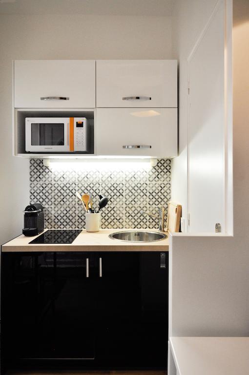 Duplex De Charme Au Coeur De Montmartre Apartamento Paris Quarto foto