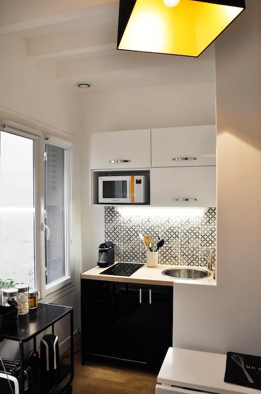 Duplex De Charme Au Coeur De Montmartre Apartamento Paris Quarto foto