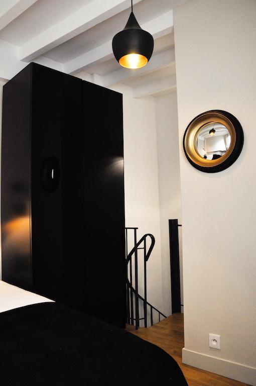 Duplex De Charme Au Coeur De Montmartre Apartamento Paris Quarto foto